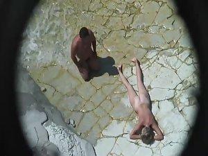 Mature nudist beach lying on the rocks Picture 8