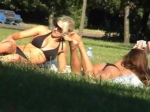 Girl friends tanning in the park Picture 6