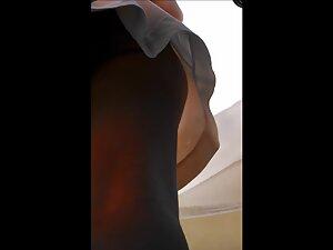 Candid camera in upskirt while she checks what street vendor got Picture 6