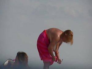Gigantic mature tits on a beach Picture 3