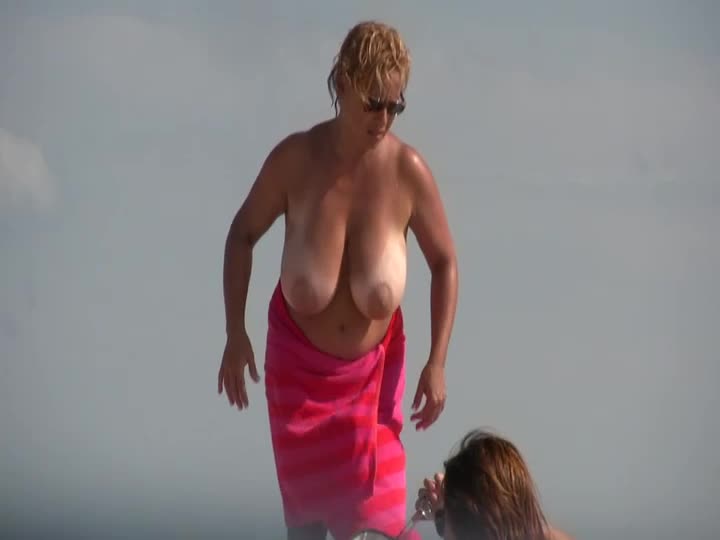 Gigantic mature tits on a beach Porn Photo