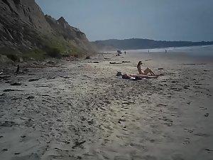 Two nudist friends recorded on scarce naked beach Picture 3