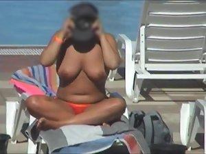 Spying a milf with big boobs on a pool Picture 4