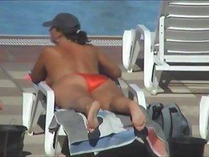 Spying a milf with big boobs on a pool Picture 8