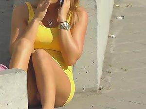 Amazing upskirt of a girl on the road curb Picture 1