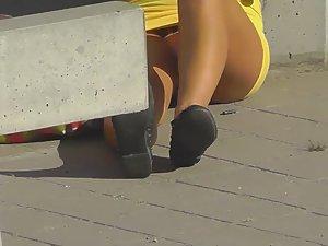 Amazing upskirt of a girl on the road curb Picture 4