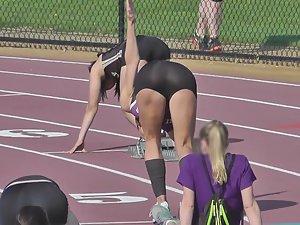 Runner girl bends over to stretch Picture 6
