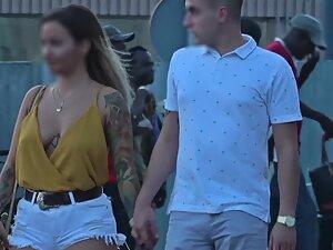 Modern punk girl got a tattoo between her tits