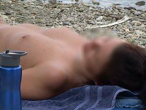 Topless hottie reading a book on the beach Picture 6