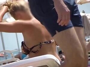 Voyeur keeps an eye on thick topless blonde at beach Picture 2
