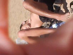 Sexy lace thong shows lots of pussy on beach Picture 3