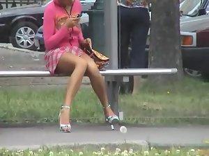 Sneaky peep of a bored girl on a bus stop Picture 3