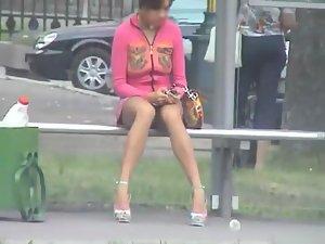 Sneaky peep of a bored girl on a bus stop Picture 8