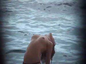 Firm topless girl stretching in the water Picture 6