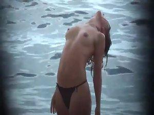 Firm topless girl stretching in the water Picture 7