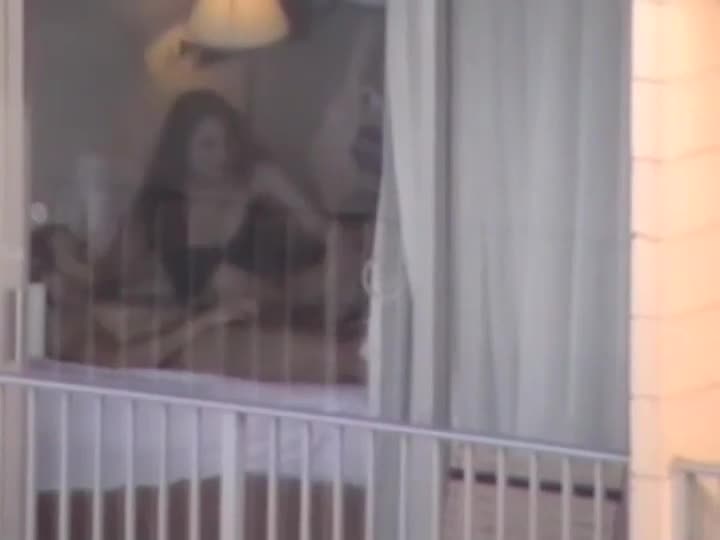 Voyeur zooms on sex in a hotel room picture