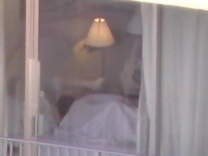 Voyeur zooms on sex in a hotel room Picture 3