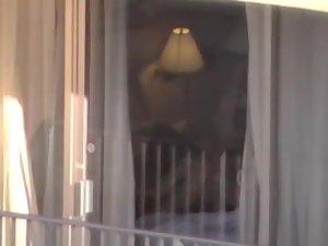 Voyeur zooms on sex in a hotel room Picture 7