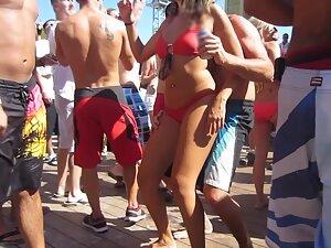 Hot girl in bikini dances and rubs her ass on someone's penis