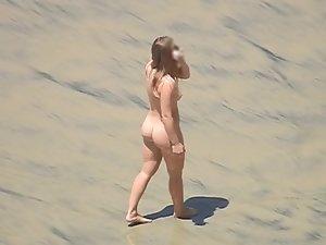Hot nudist girl plays catch on the beach Picture 7