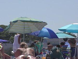 Hot girl realizes that beach voyeur is checking her out Picture 1