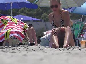 Hot girl realizes that beach voyeur is checking her out Picture 2