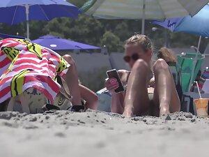 Hot girl realizes that beach voyeur is checking her out Picture 3