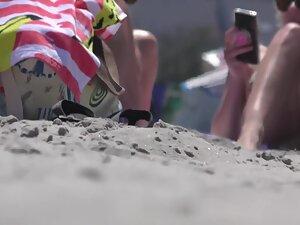 Hot girl realizes that beach voyeur is checking her out Picture 5