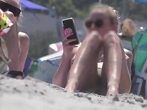 Hot girl realizes that beach voyeur is checking her out Picture 6