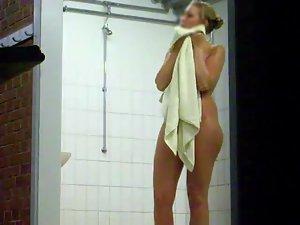 Smiling woman stepped out of a shower Picture 2