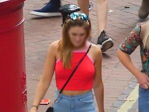 Braless tits defying gravity in red top Picture 1