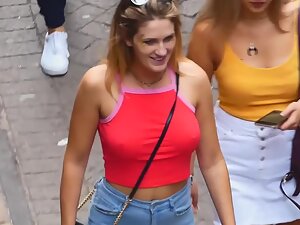 Braless tits defying gravity in red top
