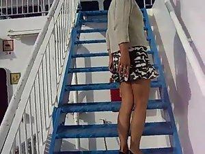 Wife teases her husband on the stairs Picture 3