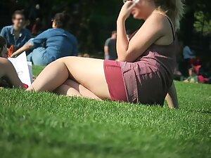 Upskirt while she rolls around on the grass Picture 6