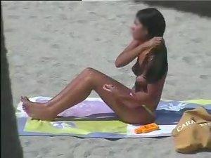 Spying a tanned topless babe Picture 2