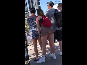 Big butt pops out of upskirt when she leans forward Picture 1