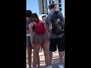 Big butt pops out of upskirt when she leans forward Picture 4