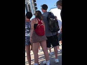 Big butt pops out of upskirt when she leans forward Picture 5