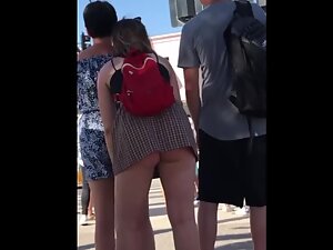 Big butt pops out of upskirt when she leans forward