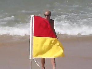 Topless beach babe in a thong bikini Picture 8