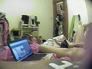 Asian girl watches porn and rubs pussy Picture 3