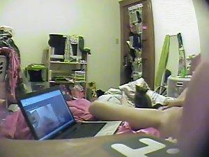 Asian girl watches porn and rubs pussy Picture 4