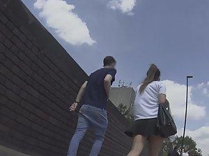 Upskirt of teen walking with boyfriend Picture 3