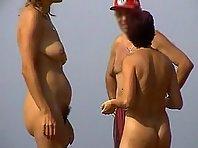 Nudists standing and chit chatting Picture 1