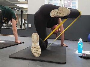 Peeping while teen girl sweats during a gym workout Picture 1