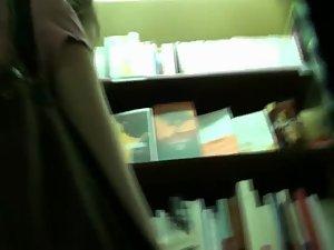 Upskirt of a bookworm babe Picture 2