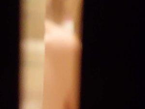 Peeping on naked sister while she dries her hair Picture 1