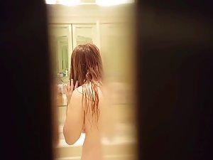 Peeping on naked sister while she dries her hair Picture 6