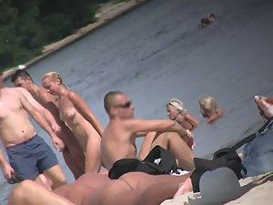 Naked beach girl spreads legs and smokes cigarette Picture 7