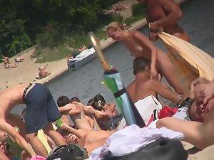 Naked beach girl spreads legs and smokes cigarette Picture 8